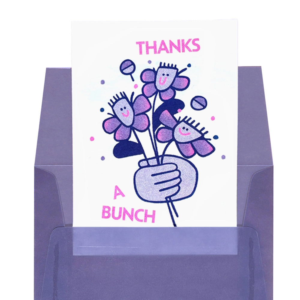 Card with cartoon flowers and 'Thanks a Bunch' text on a purple envelope.