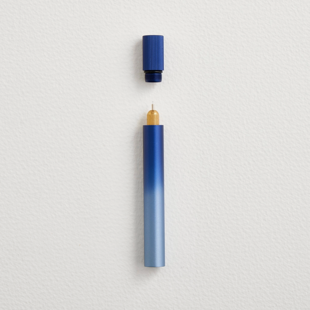 Blue pen with a gradient design on a light gray background