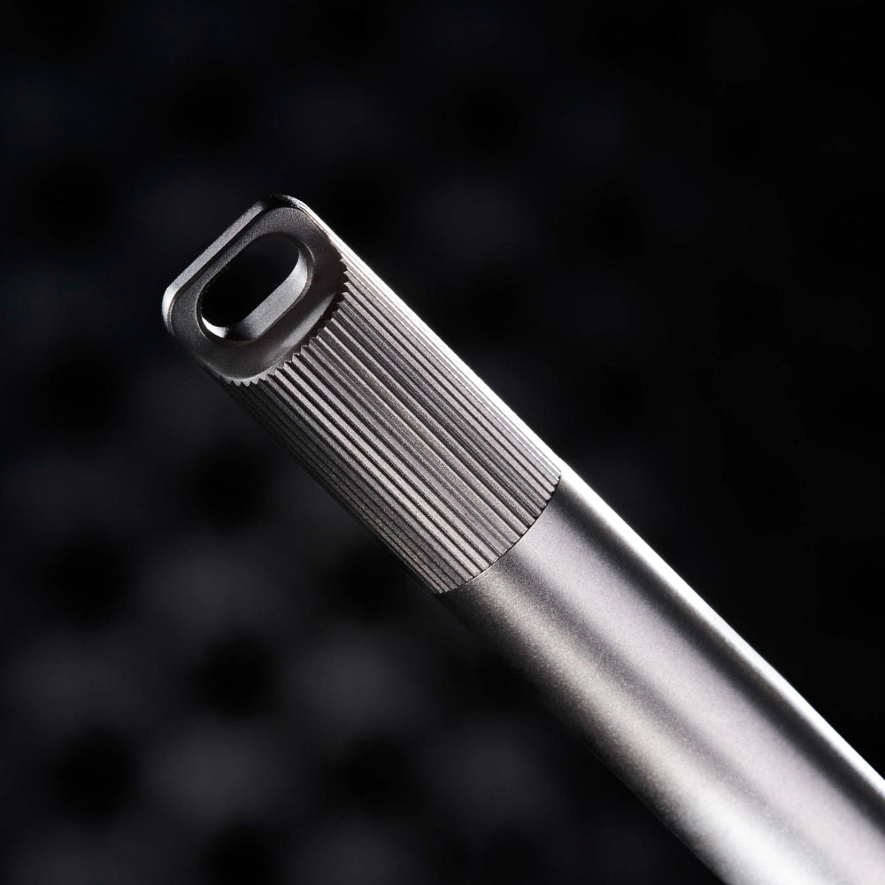 Close-up of a the titanium barrel on a dark background