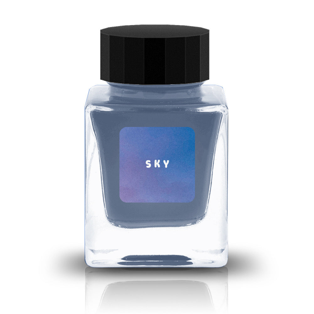 Bottle of ink labeled 'SKY' with a black cap on a white background