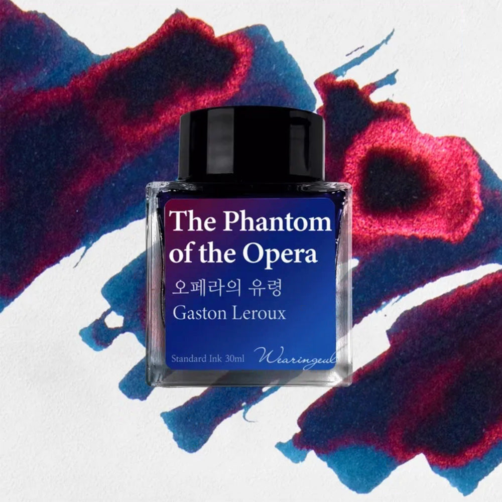 Ink bottle labeled 'The Phantom of the Opera' by Gaston Leroux on a colorful abstract background