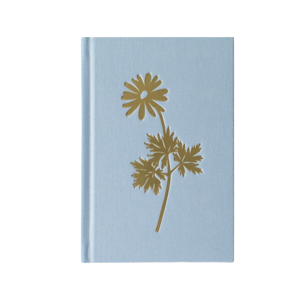 A light blue journal with a gold foil daisy in the center.