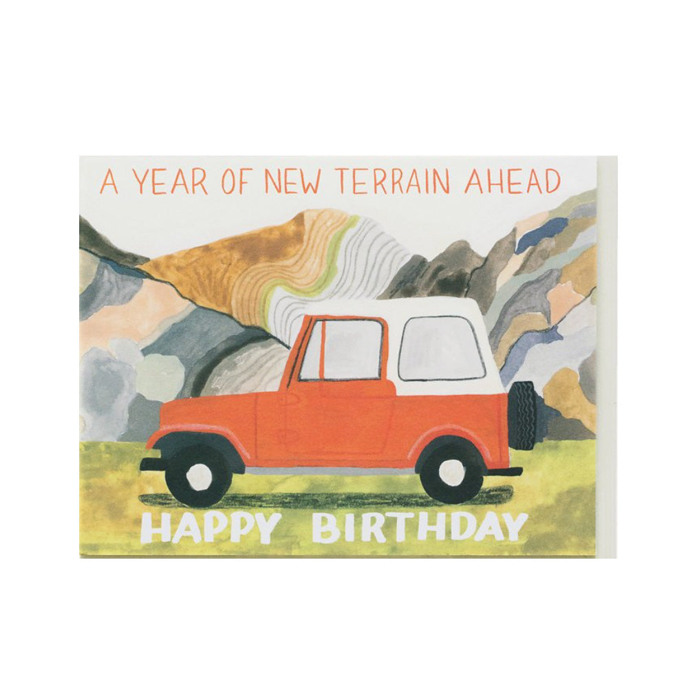 Birthday card with an illustration of a red car on a mountainous background and text 'A Year of New Terrain Ahead, Happy Birthday'.
