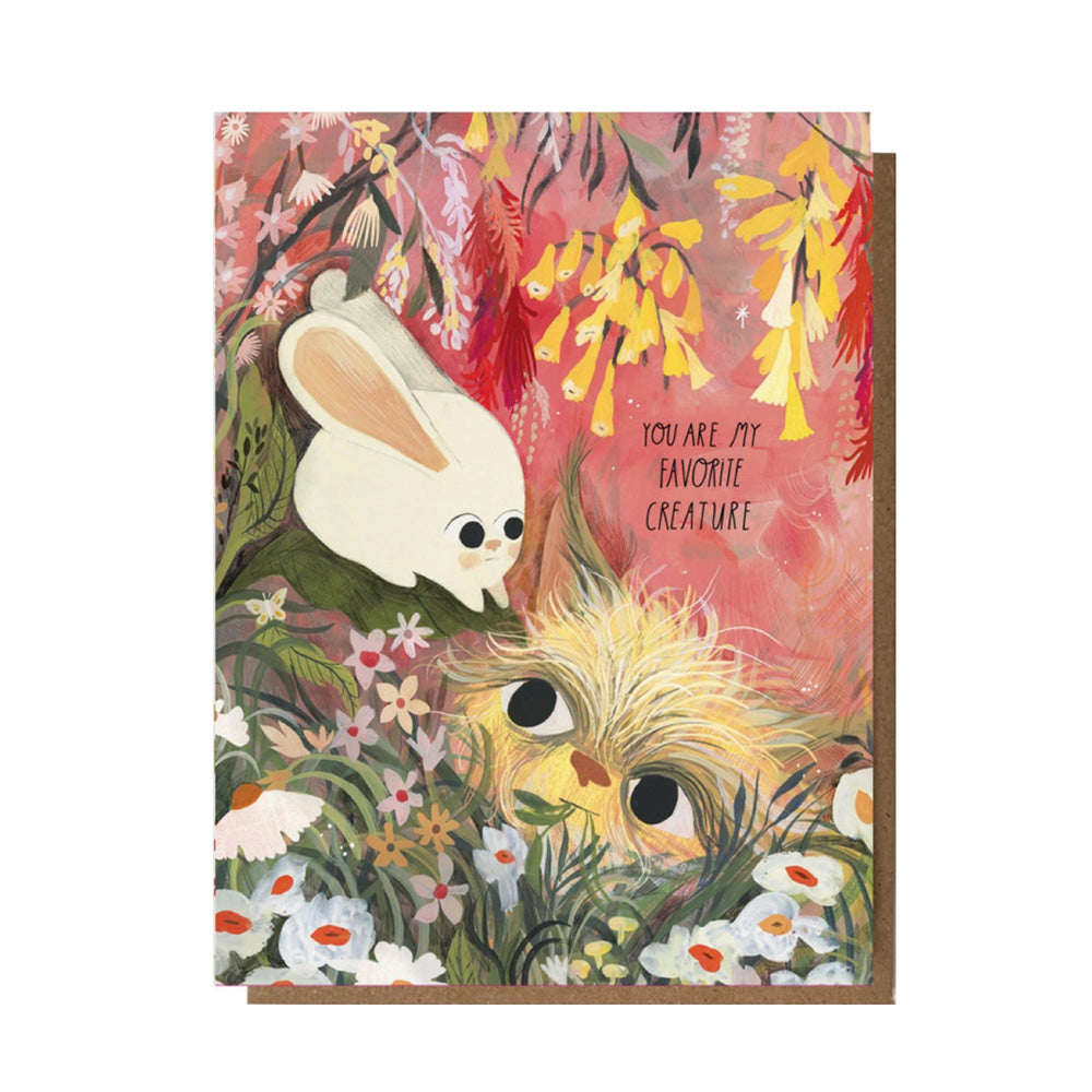 Greeting card with cartoon animals and floral design on a pink background and text, "You are my favorite creature"